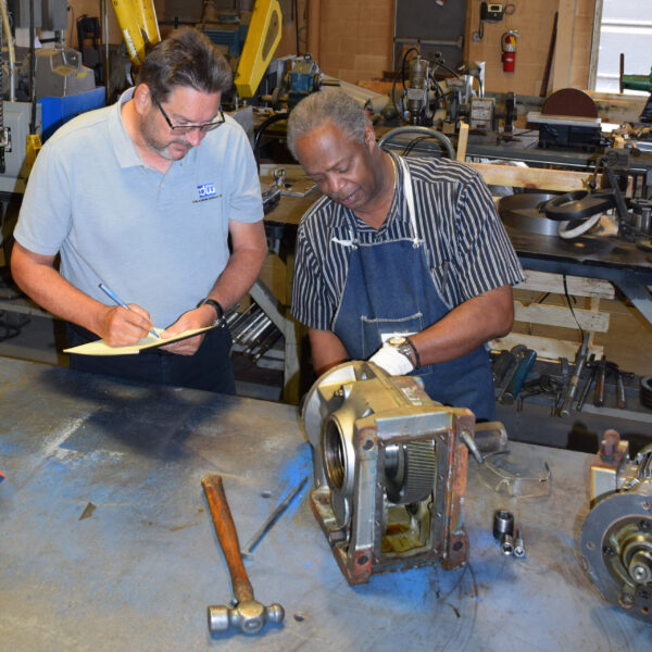 CDWdrives shop technician and engineer analyzing repair 